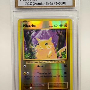 May include: A graded 2016 Pokémon Pikachu Evolutions Holo card, GEM MINT 10, featuring a yellow Pikachu character. The card has the text "Pikachu" and "LV.12 60 HP" on the front. The card is encased in a protective holder.