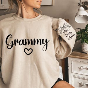 Custom This Grammy Wears Her Heart On Her Sleeve Hoodie, Personalized Mom Sweatshirt With Kids Names, Cute Momma Outfit, Mothers Day Gifts