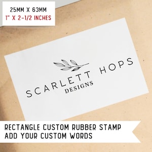 May include: A white rectangle with black text that reads "SCARLETT HOPS DESIGNS" and a black line drawing of a branch with leaves. Below the rectangle is black text that reads "RECTANGLE CUSTOM RUBBER STAMP ADD YOUR CUSTOM WORDS". The background is a brown paper texture.