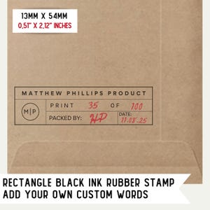 May include: A brown paper envelope with a red rectangular stamp that reads "MATTHEW PHILLIPS PRODUCT" and includes the text "PRINT 35 OF 100", "PACKED BY: HP", and "DATE: 11.08.25". The envelope also has a red rectangular label that reads "13MM X 54MM 0.51" X 2.12" INCHES". Below the stamp is the text "RECTANGLE BLACK INK RUBBER STAMP ADD YOUR OWN CUSTOM WORDS".