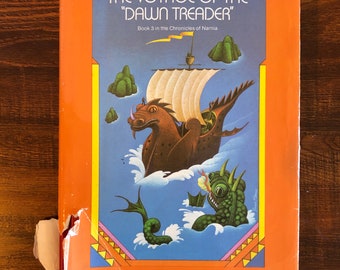 The Vogage of the Dawn Treader by C S Lewis, hardback, dust jacket Macmillan Publishing, 1952 first American edition.