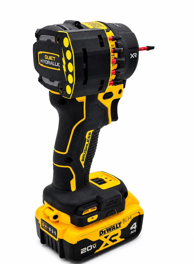 May include: Black and yellow cordless drill with the text "QUIET HYDRAULIC" and "BRUSHLESS". The drill has a black handle and a yellow battery pack. The battery pack is labeled "20V" and "4 AH".