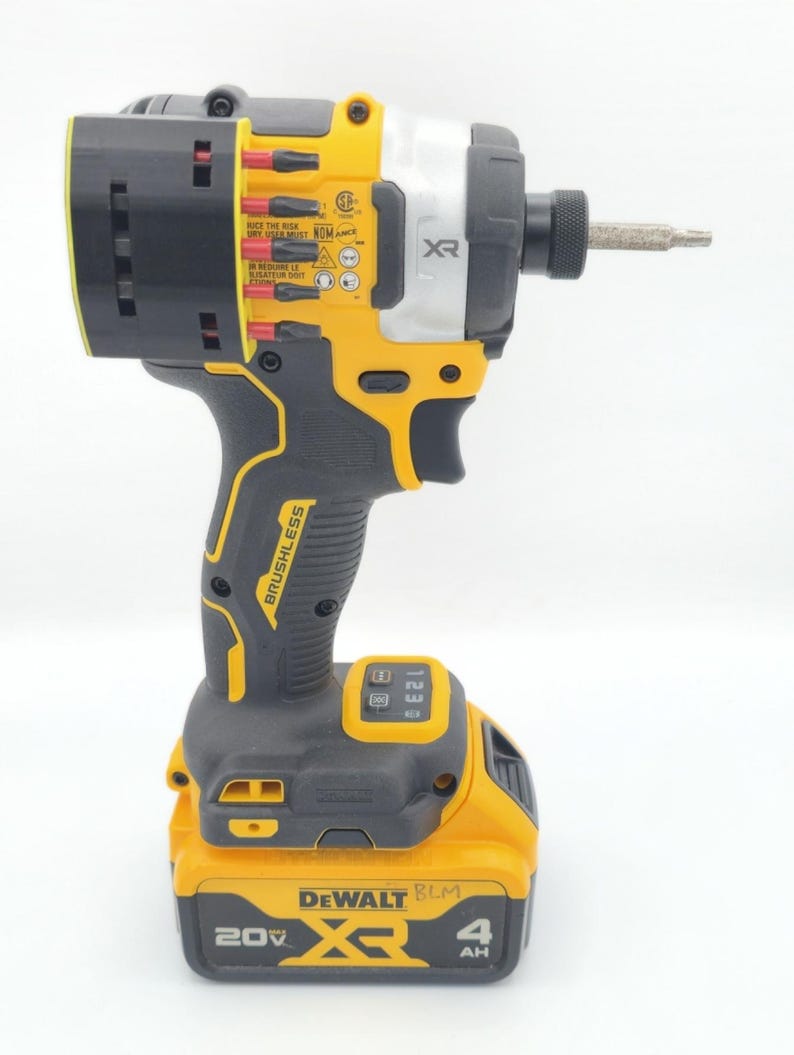 May include: A yellow and black DeWalt XR brushless impact driver with a silver head and a black battery. The tool has a black handle and a silver bit attached. The battery reads "20V XR 4 AH".