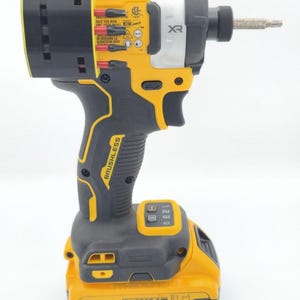 May include: A yellow and black DeWalt XR brushless impact driver with a silver head and a battery pack. The tool has the text "BRUSHLESS" and "20V XR" printed on it. The battery pack is labeled "4 AH".