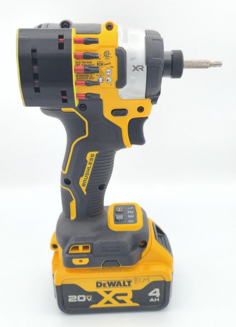 May include: A yellow and black DeWalt XR brushless impact driver with a silver head and a battery pack. The tool has the text "BRUSHLESS" and "20V XR" printed on it. The battery pack is labeled "4 AH".