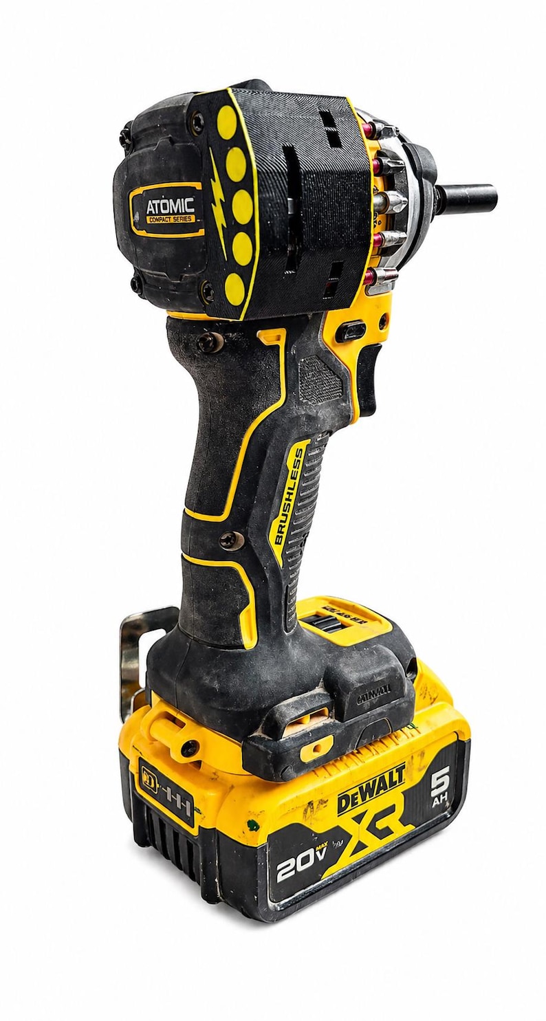 May include: A black and yellow cordless drill with the text "ATOMIC COMPACT SERIES" and "BRUSHLESS". The drill has a 20V battery with the text "DEWALT" and "5 AH".
