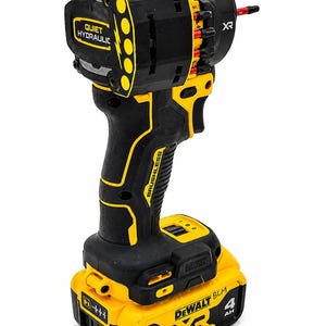 May include: Black and yellow cordless drill with a black handle and a yellow battery pack. The drill has the text "QUIET HYDRAULIC" and "BRUSHLESS" printed on it. The battery pack reads "20V" and "4 AH".