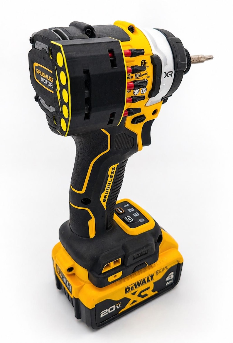 May include: A black and yellow cordless impact driver with a drill bit attached. The tool has the text "BRUSHLESS MOTOR" and "DEWALT" printed on it. The battery is labeled "20V".