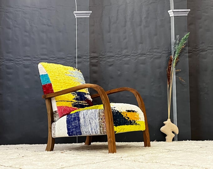 Boho Chic Multicolor Textured Armchair with Wooden Frame | ModernEclectic, BohoChic, StylishFurniture, UniqueDesign, AccentChair