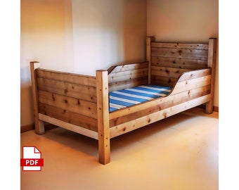 May include: A handcrafted wooden bed frame with a headboard and footboard. The bed is made from light-coloured wooden planks. The mattress features a blue and white striped pattern. The bed is suitable for a child's bedroom.