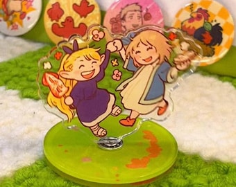Dungeon Meshi Marcille e Falin de mãos dadas e comida girando alegremente em um suporte de acrílico para piquenique por Nienie