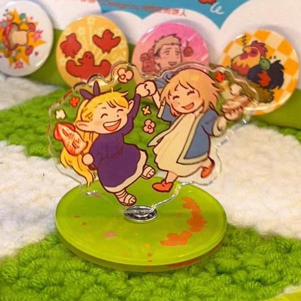 ダンジョン飯 マルシルとファリンが手をつないで楽しそうに食べ物を回しまくるアクリルスタンドピクニック by ニーニー