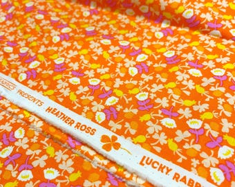 Half Yard cut of Lucky Rabbit Calico fabric in orange