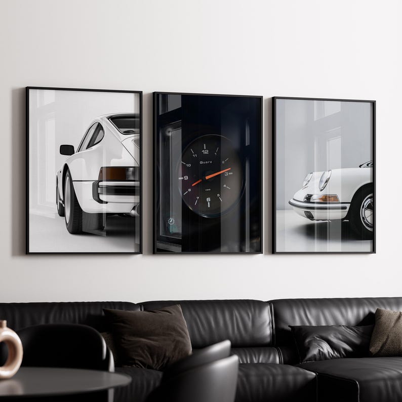 May include: Three black framed prints of white Porsche cars. The center print features a close-up of a car's dashboard with a round gauge that reads "Quarts".