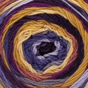 May include: A circular skein of yarn featuring a variegated color pattern. The fibers are wound in concentric rings displaying alternating shades of deep purple, golden yellow, soft lavender, and muted rose, creating a continuous gradient effect.
