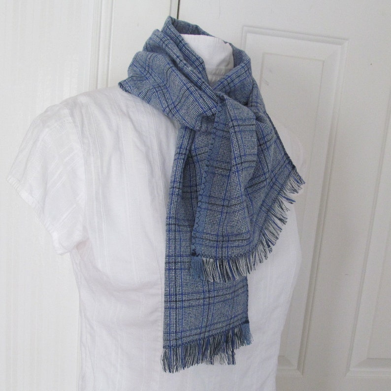 Blue and white plaid linen blend scarf is so soft and versatile. Simply wrap around your neck and loosely tie, leaving ends to tuck into your jacket or coat.