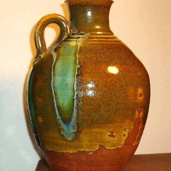 Jug with glass runs, wheel thrown and soda fired