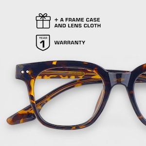 May include: Tortoise shell eyeglasses with a square frame and clear lenses. The glasses are shown from the side, with the left lens in focus. The text "1 YEAR WARRANTY" is visible in the top left corner of the image.