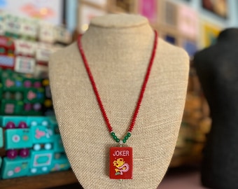 Firecracker Red Joker Mahjong Tile on with Red Coral and Green Jade