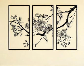 May include: Three-panel wall art featuring a black floral branch design. Each panel has a black frame and a cream-colored background. The artwork depicts a detailed illustration of cherry blossoms and leaves.