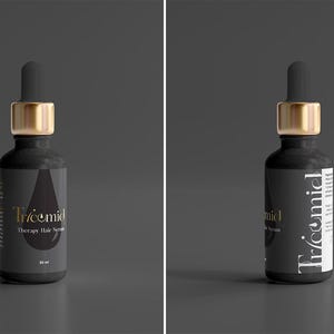 Może przedstawiać: Czarna butelka serum do włos&oacute;w Tricemid Therapy ze złotą nakrętką i zakraplaczem. Butelka ma czarną etykietę ze złotym i białym tekstem. Etykieta ma kształt kropli. Na szarym tle.