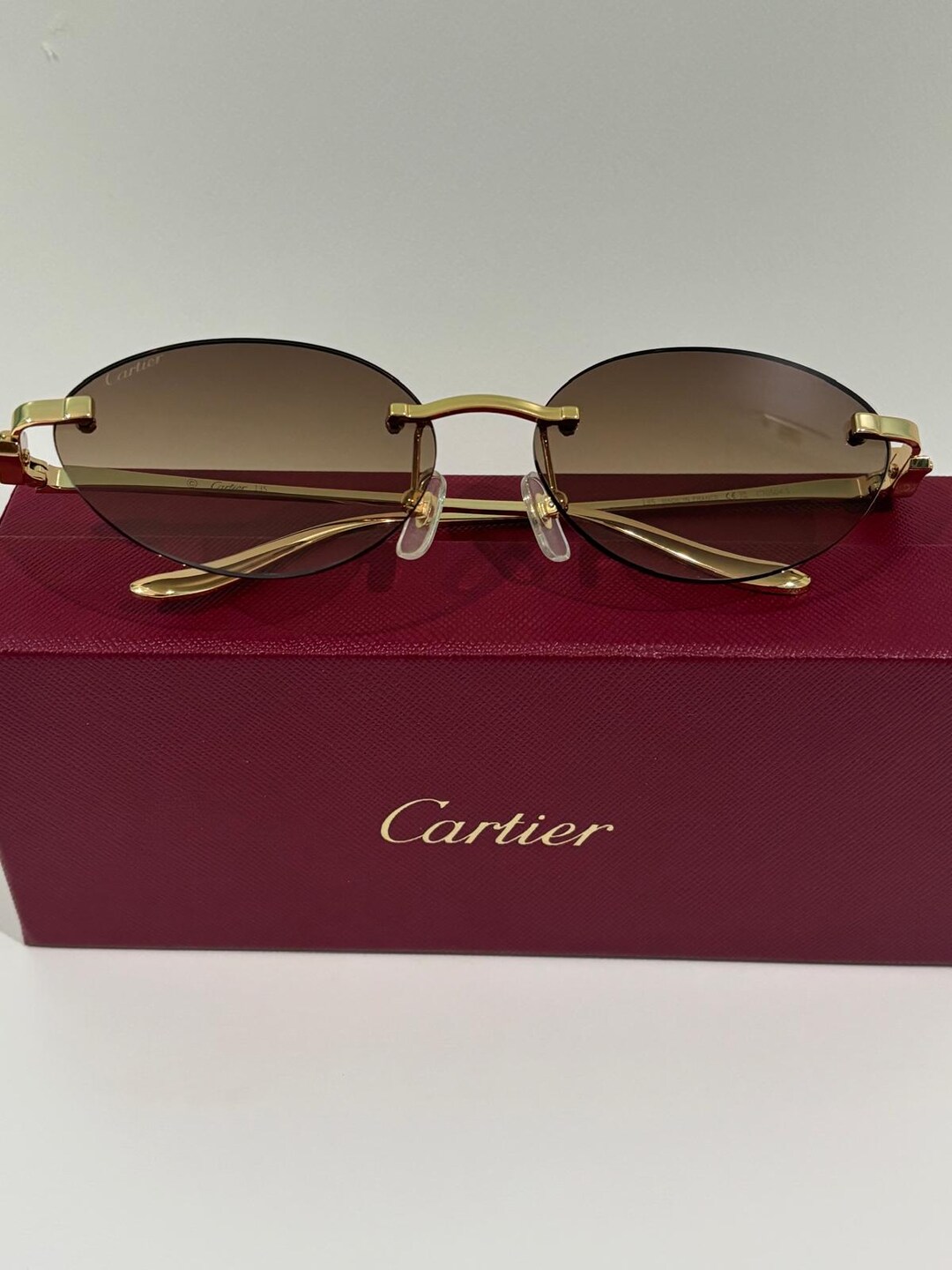 Cartier Women\'s Rimless Sunglasses - Brown Lenses with Gold Frame Cartier Panthère Rimless Sunglasses Brown x Gold Women Front  main image 3