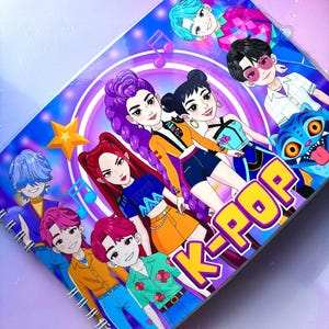 May include: Spiral-bound notebook with a colourful K-POP design. The cover displays cartoon illustrations of people in bright outfits, with the text "K-POP" in large, yellow letters. Musical notes and stars are also included in the design.