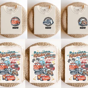 May include: Cream-colored t-shirts with various car-themed graphics. Some shirts feature a single car design with the word "NAME" below. Other shirts display a colorful illustration of multiple cars with the text "RADIATOR SPRINGS Lightning Mc Queen".
