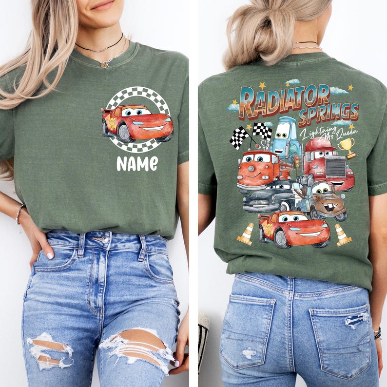 May include: Green t-shirt featuring a cartoon car design with the text "NAME" on the front. The back of the shirt displays a graphic of various cartoon cars with the text "RADIATOR SPRINGS Lightning McQueen".