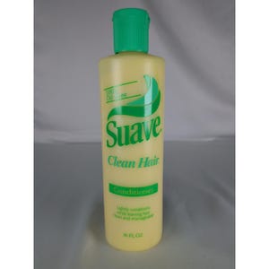May include: A yellow plastic bottle of Suave Clean Hair Conditioner with a green flip-top cap. The bottle has green text and a green logo. The bottle contains 16 fl oz of conditioner.