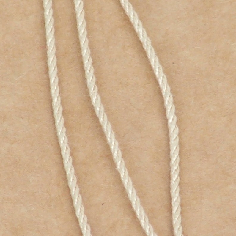 Pure silk cord strands showing twist and size.