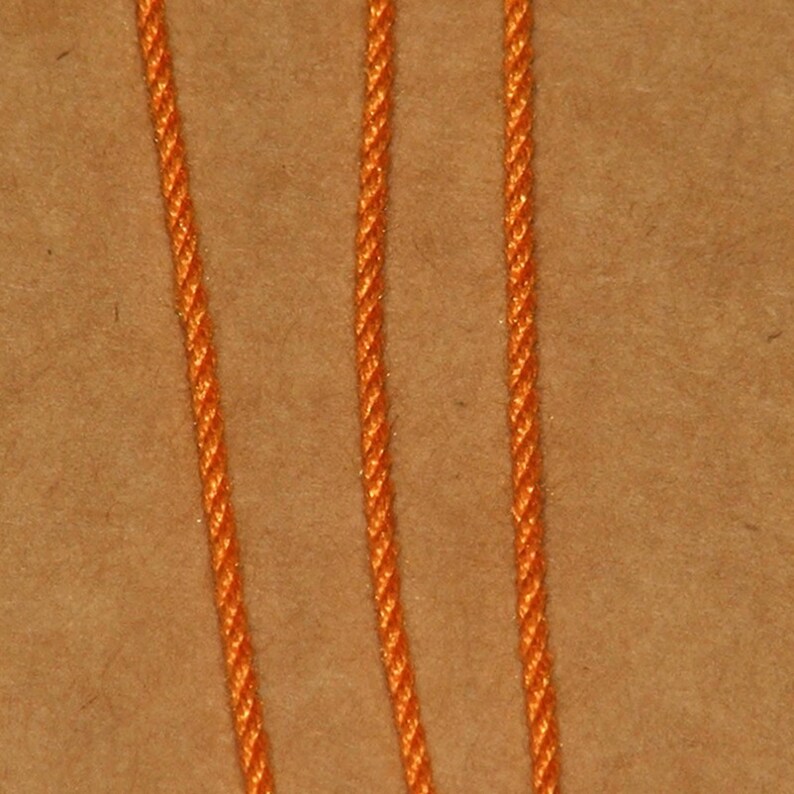 Orange handmade pure silk cord (1mm) pack of two strand detail.