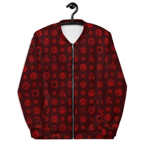 May include: A red bomber jacket with a repeating pattern of red symbols on a dark red background. The jacket has a zipper closure and two pockets.