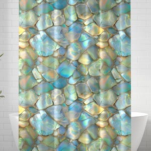 May include: A shower curtain featuring a repeating pattern of iridescent, multi-faceted shell fragments in shades of teal, blue, and soft yellow. The design mimics a mosaic of polished abalone pieces with a glossy, reflective finish throughout.