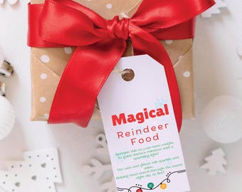 May include: A white gift tag with a red and green snowflake design. The tag reads "Magical Reindeer Food" and includes instructions to sprinkle the food on the lawn to guide Santa's reindeer with a sparkling light. The oats and glitter will sparkle and shine, helping them travel through the stars right on time!"