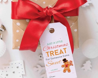 May include: A white gift tag with a green and orange design. The tag says "Just a little Christmas Treat for someone extra sweet." It also features a gingerbread man illustration and the text "Merry Christmas!" and "From:"