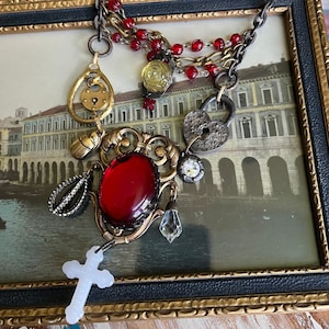 Ornate Bib Necklace, Blood Red Glass Cabochon, Milk Glass Cross, Rustic Locks