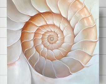 May include: A close-up of a seashell with a spiral pattern. The shell is a light beige color with hints of pink and white. The shell is a natural object and has a smooth, textured surface.