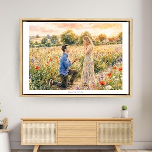 May include: A framed watercolour painting depicting a person kneeling to propose to another person in a vibrant wildflower meadow at sunset. The scene features rolling hills in the background and the date 06.04.2024 printed at the bottom centre.