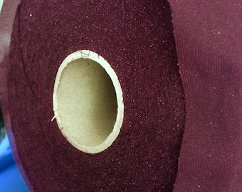 Lightweight synthetic fusible iron-on interfacing fabric in  dark purple; for garments