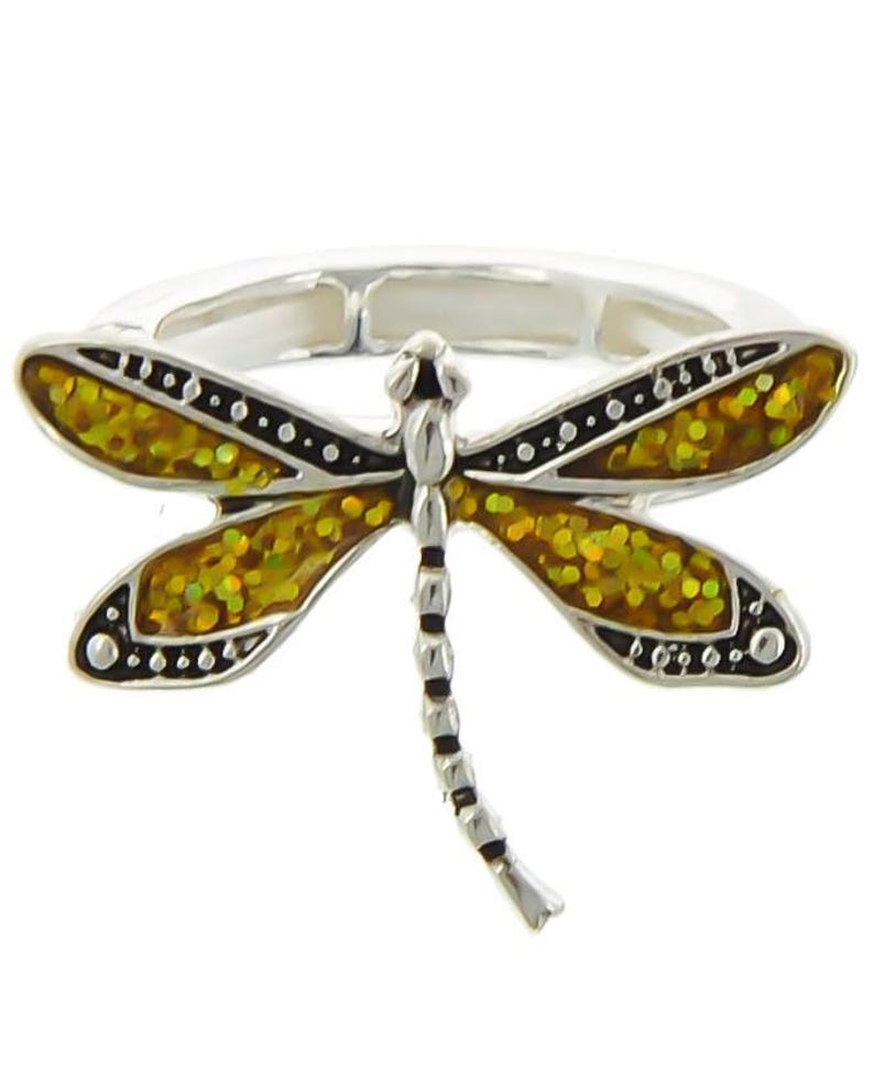 May include: A silver ring with a dragonfly design. The dragonfly's wings are yellow and green with black accents.