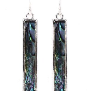 May include: A pair of rectangular dangle earrings. Each earring features a silver-toned frame surrounding a shimmering, iridescent abalone shell inlay. The abalone displays shades of blue, green, and purple. The earrings hang from a simple hook.