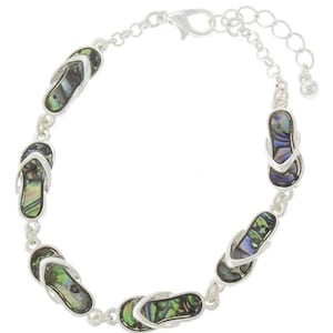 May include: Silver-toned bracelet featuring seven flip-flop charms. Each charm has a mother-of-pearl inlay with iridescent green, blue, and black hues. The bracelet has an adjustable chain and a lobster clasp closure, perfect for beach lovers.