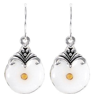 May include: A pair of silver drop earrings. Each earring has a white, circular pendant with a small, yellow centre. The pendants are framed with a decorative silver design and black accents. The earrings hang from a simple hook.