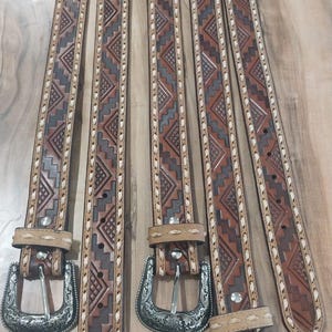 Hand-tooled leather belt with aztec design