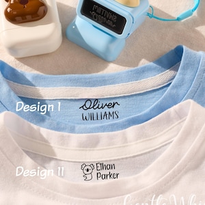May include: A light blue and white t-shirt with the text "Design 1" and the name "Oliver WILLIAMS" printed on it. A white t-shirt with the text "Design 11" and the name "Ethan Parker" printed on it. Two label makers with bear designs.