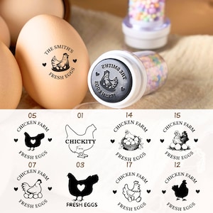 May include: Egg stamps featuring chicken and egg designs. One stamp is used on an egg, displaying "The Smith's Fresh Eggs." Other designs include "Chicken Farm" with various chicken illustrations and text.