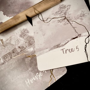 May include: A set of cards with black and white illustrations. One card shows a house with the word "House" written on it. Another card shows a tree with the text "Tree 5" written on it.