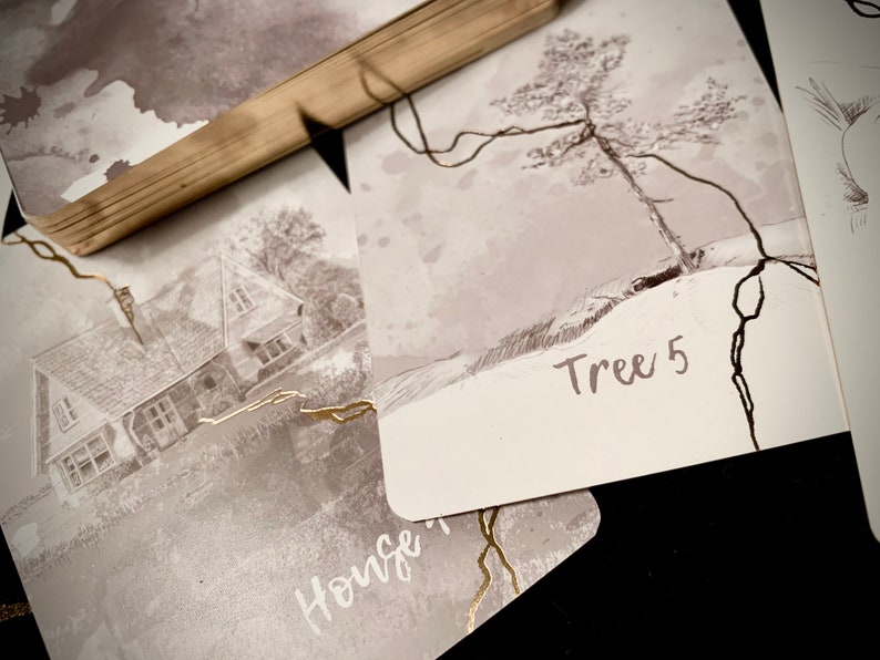 May include: A set of cards with black and white illustrations. One card shows a house with the word "House" written on it. Another card shows a tree with the text "Tree 5" written on it.