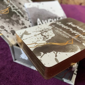 May include: A stack of cards with a gray and white watercolor design and gold accents. The top card has the text "Autumn Wonderland" and "G & M Witherspoon 2019/2020".